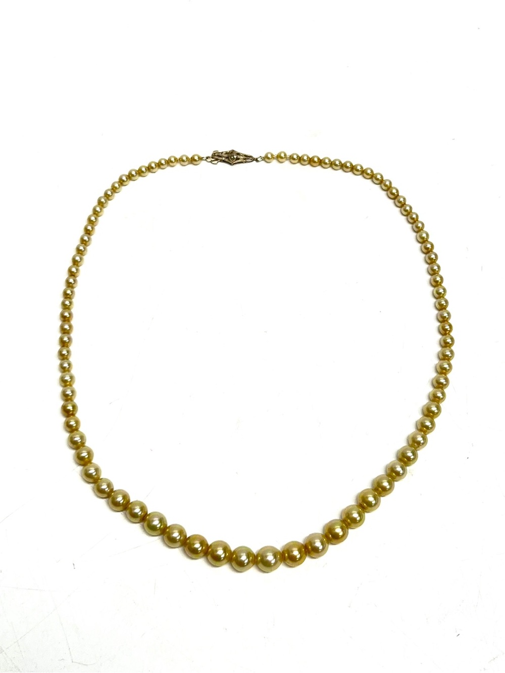 Vintage pearl necklace with 14 karat gold clasp.